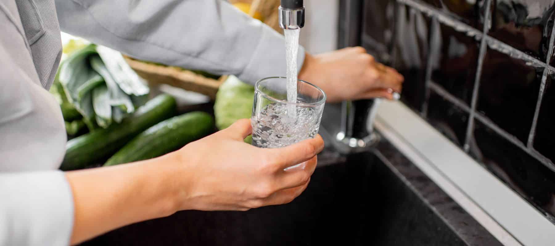 homeowner getting tap water