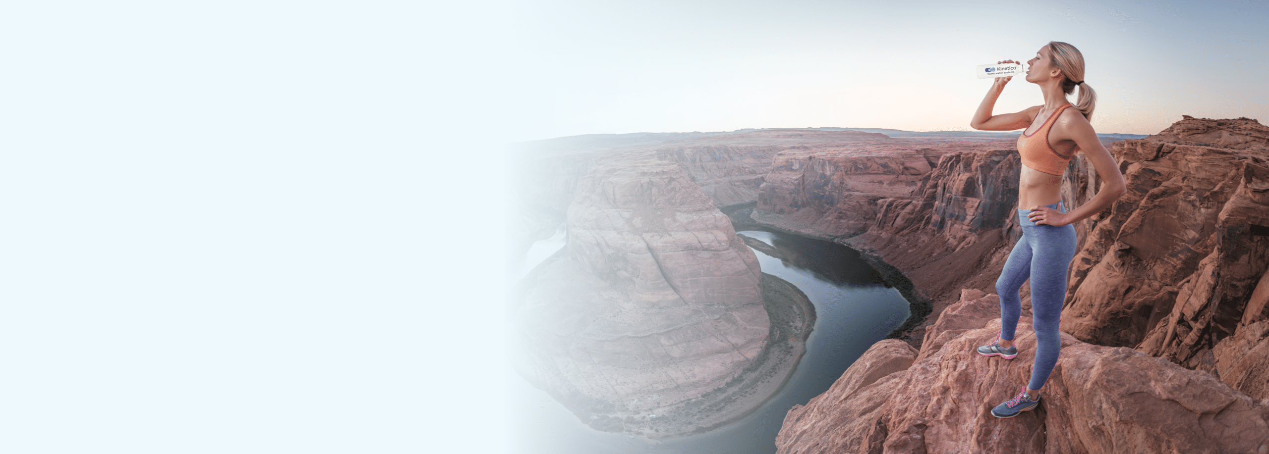 woman drinking water over the grand canyon