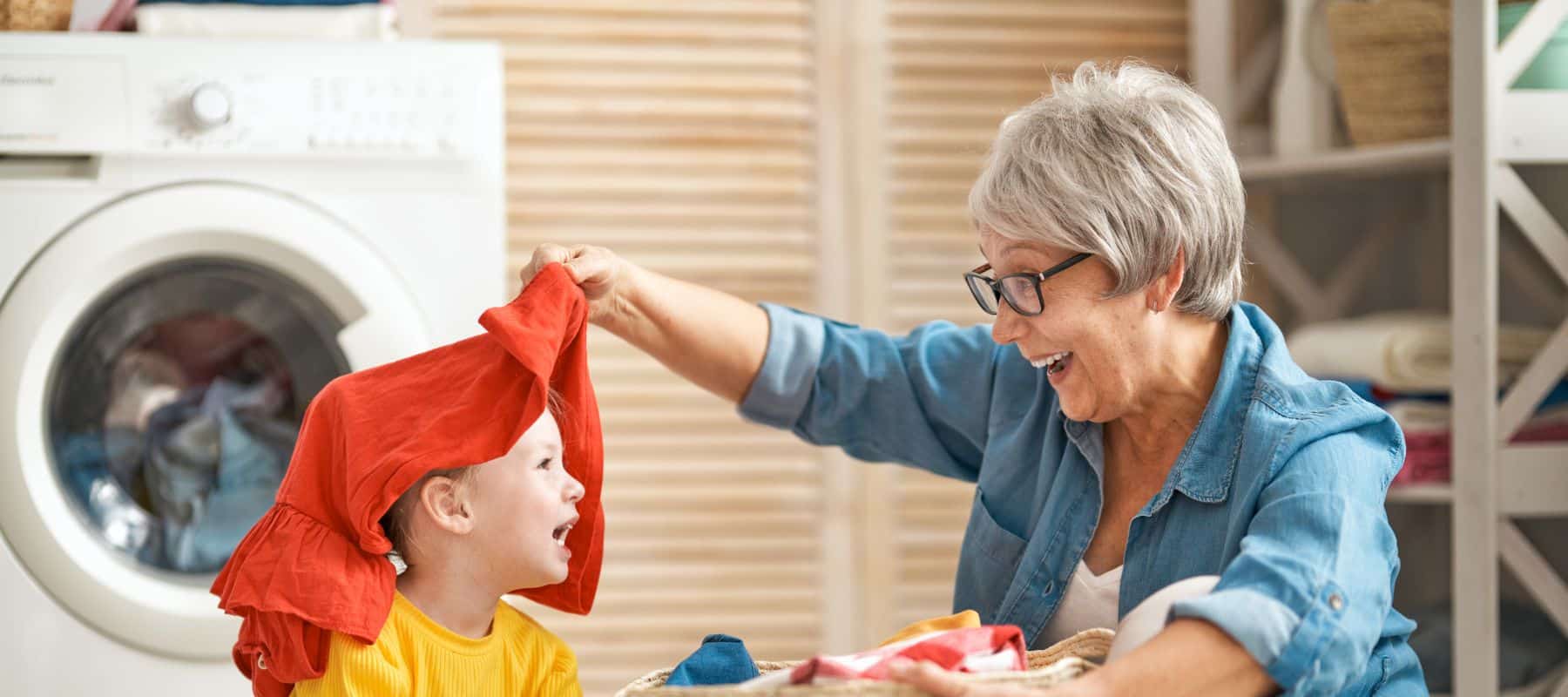 grandparent and grandson doing the laundry