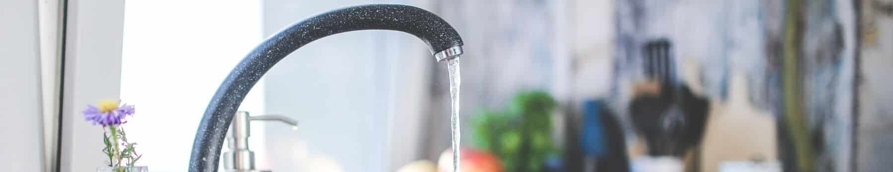 faucet with water pouring from the tap